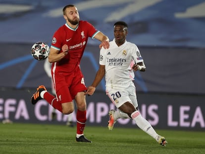 Real Madrid forward Vinicius Jr. and Liverpool defender Nathaniel Phillips.