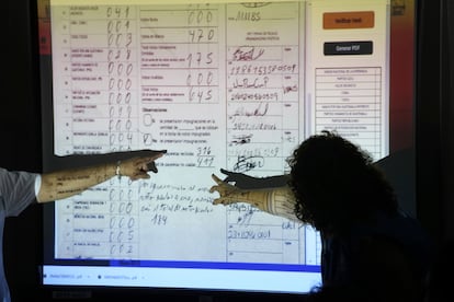 Election officials review voting records in the presence of lawyers from the political parties; July 4, 2023.

