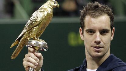 France's Richard Gasquet holds his trophy after he won the final against Nikolay Davydenko of Russia at the Qatar Open in Doha