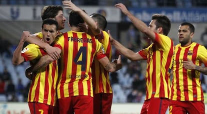 Barcelona players celebrate after one of their five goals against Getafe.