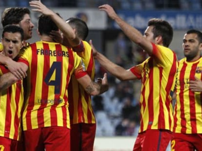 Barcelona players celebrate after one of their five goals against Getafe.
