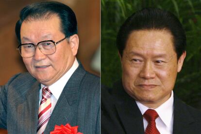 Li Changchun y Zhou Yongkang, miembros del Politburó del Partido Comunista Chino.