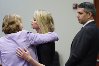 Elaine Bredehoft, Amber Heard's lawyer, hugs the actress following the verdict.