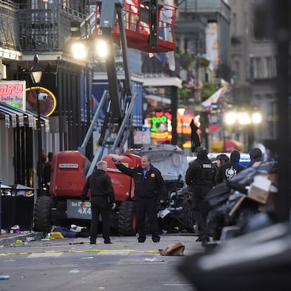 Emergency services attend the scene on Bourbon Street after a vehicle drove into a crowd on New Orleans' Canal and Bourbon Street, Wednesday Jan. 1, 2025. (AP Photo/Gerald Herbert)