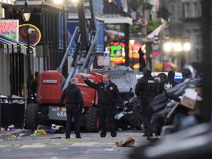 Emergency services attend the scene on Bourbon Street after a vehicle drove into a crowd on New Orleans' Canal and Bourbon Street, Wednesday Jan. 1, 2025. (AP Photo/Gerald Herbert)