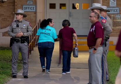 The Texas Department of Public Safety has stationed nearly three dozen police officers at Uvalde schools for the return to classes. Pictured above, officers guard the entrance to Flores Elementary.