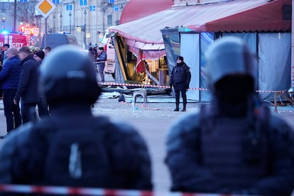 Russian police officers are seen at the site of an explosion at a cafe in St. Petersburg, Russia, on April 2, 2023.