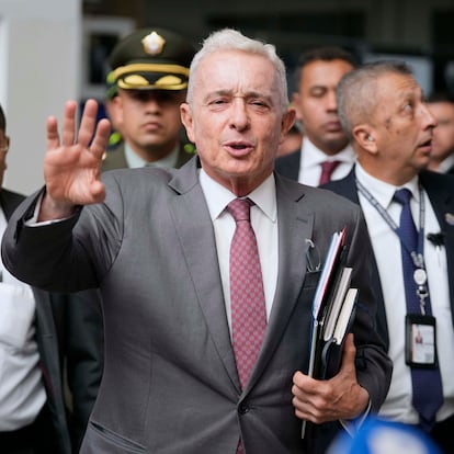 FILE - Former President Alvaro Uribe leaves court after a hearing in his trial over witness tampering and bribery charges in Bogota, Colombia, Feb. 10, 2025. (AP Photo/Fernando Vergara, File)