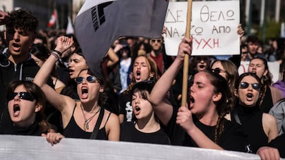 University students chant slogans during a protest as they head to the headquarters of private operator Hellenic Train, in Athens on Friday.