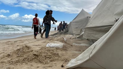 Several displaced families in the Al Mawasi area in the southern Gaza Strip try to protect their precarious tents with sandbags, September 17, 2024.