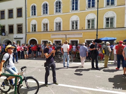 Filmmaker Günter Schwaiger, filming in front of Hitler's birthplace.