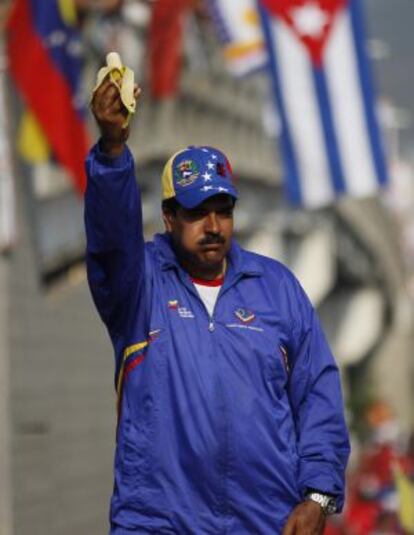 Venezuela&#039;s acting President Nicol&aacute;s Maduro eats a banana during a presidential election campaign rally in Catia La Mar.