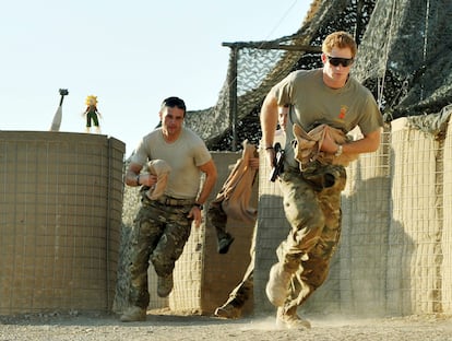 File photo dated 03/11/2012 of Prince Harry (right) or just plain Captain Wales as he was known in the British Army, racing out from the VHR (very high readiness) tent to scramble his Apache with fellow Pilots, during his 12 hour shift at the British controlled flight-line in Camp Bastion southern Afghanistan, where he was serving as an Apache Helicopter Pilot/Gunner with 662 Sqd Army Air Corps, from September 2012 for four months until January 2013. The former soldier said the time he spent in the Army, when he was "just Harry", was "the best escape I've ever had" and he had considered giving up his title. Issue date: Thursday September 8, 2022.