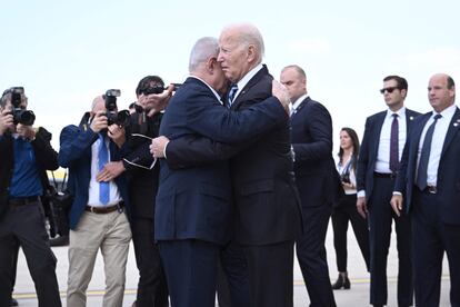 Israel Prime Minister Benjamin Netanyahu (l) hugs U.S. President Joe Biden upon his arrival at Tel Aviv's Ben Gurion airport on October 18, 2023.