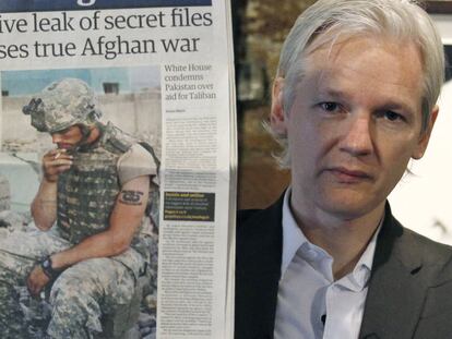 WikiLeaks founder Julian Assange holds the front page of a newspaper during a press conference in London in July 2010.
