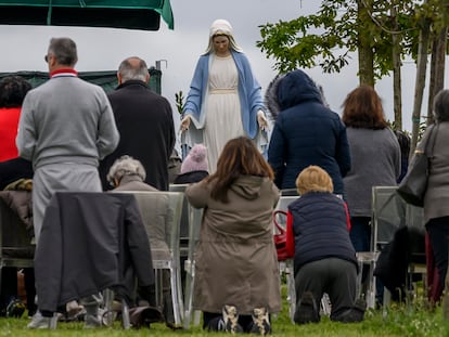 The followers of the psychic Gisella Cardia take part in prayer, while kneeling before the Virgin in Trevignano Romano, a town in the Metropolitan City of Rome.