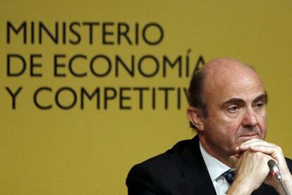 Guindos during a news conference in Madrid.