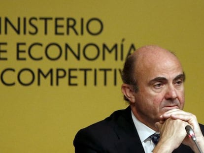 Guindos during a news conference in Madrid.