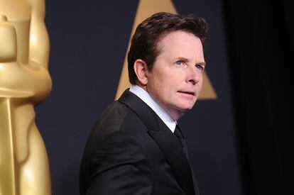 Actor Michael J. Fox poses in the press room at the 89th annual Academy Awards