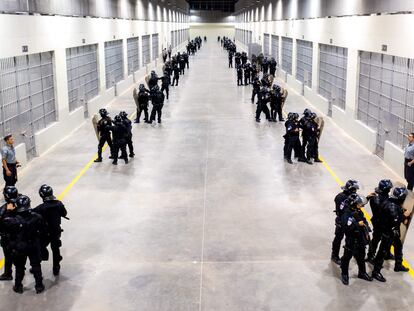 Police officers standing guard inside the newly inaugurated prison, at an isolated rural area in a valley near Tecoluca, 74 km southeast of San Salvador