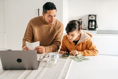 Dad and son - homeschooling from home office