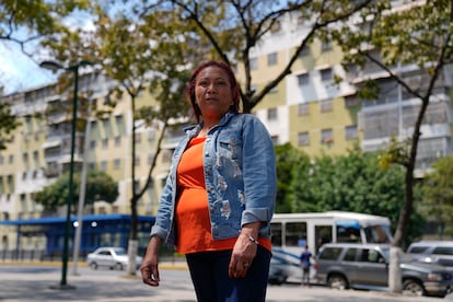 Iraida Piñero, public hospital cleaning worker, poses for a picture in a square in Caracas, Venezuela, Friday, February 24, 2023.