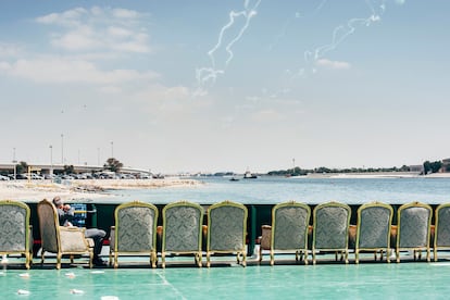 On the deck of a ferry while jet fighters, helicopters and cargo aircraft fly low. IDEX Expo, Abu Dhabi, UAE, 2019. 