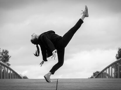 Side View Full Length Of Woman Dancing On Footbridge