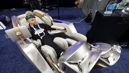 A person tests the Phantom Neo massage chair on January 7, during the previous day of the CES in Las Vegas.