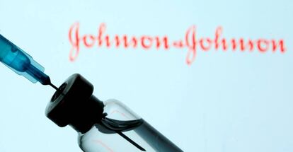 FILE PHOTO: Vial and sryinge are seen in front of displayed Johnson&Johnson logo in this illustration taken