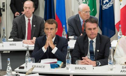 O presidente francês, Emmanuel Macron, junto a seu homólogo brasileiro, Jair Bolsonaro, no G20 de Osaka, nesta sexta-feira.