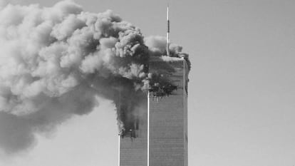 Smoke pours from the World Trade Center in New York City after being hit by two planes, on September 11, 2001.
