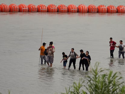 Migrants who crossed the Rio Grande from Mexico