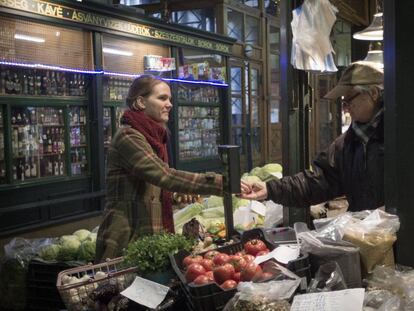 Sarolta Molnar buys groceries at Rákóczi Market in Budapest.