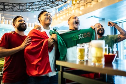 Mexican fans watching a soccer game at a bar