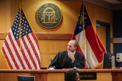 Judge Scott McAfee listens as an attorney speaks during a motions hearing for former president Donald Trump's election interference case, in Atlanta, Georgia, January, 12 2024.