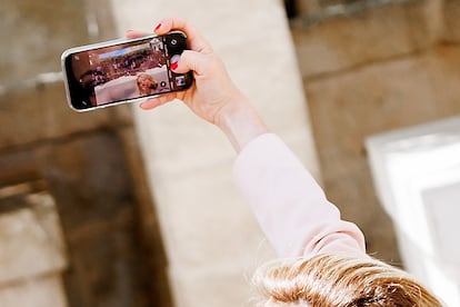 Giorgia Meloni takes a selfie at the start of the G7 summit. 