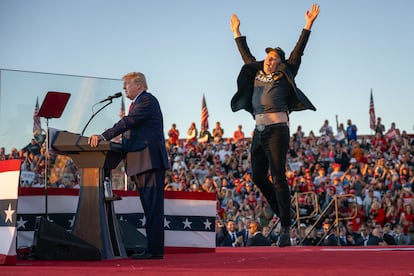 Elon Musk jumps on stage as Donald Trump speaks at a rally in Butler, Pennsylvania, on October 5.