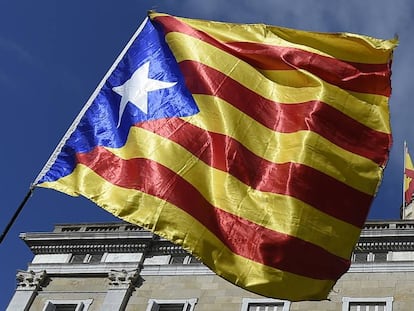 A Catalan pro-independence flag in front of the Catalan government headquarters.