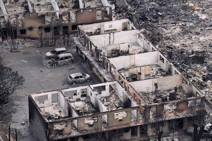 An aerial photo shows destroyed buildings, burned trees and burned cars caused by wildfires in Lahaina town in Maui. 