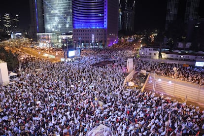 Protesters with Israeli flags during a mass protest against the government's justice system reform plans in Tel Aviv, Israel, 25 March 2023.