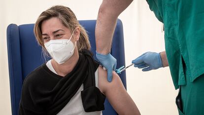 A health worker receives the AstraZeneca vaccine in Valencia.