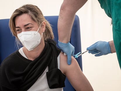 A health worker receives the AstraZeneca vaccine in Valencia.