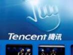 FILE PHOTO: Dancers perform underneath the logo of Tencent at the Global Mobile Internet Conference in Beijing May 6, 2014. REUTERS/Kim Kyung-Hoon /File Photo