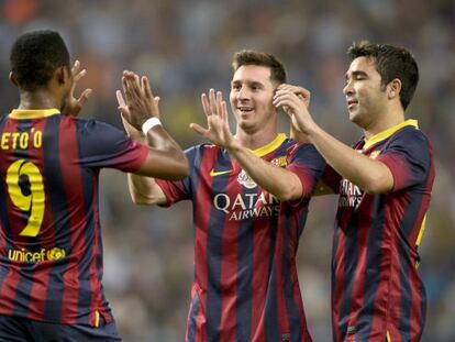 Eto'o, Messi y Deco celebran un gol.