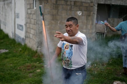 Genaro Santiago sets off fireworks during the celebrations of the relic's visit to the church of San Cristobal Martir.