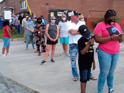 Voters wait in line to vote outside the Chatham County Board of Elections office in Savannah, Ga., on Wednesday, Oct. 14, 2020.