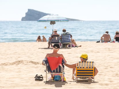 A couple sunbathes in Benidorm, Spain, in a photograph taken last March during one of the early heat waves that hit the country this year.