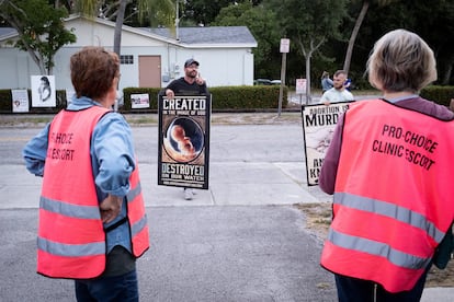 Two anti-abortion rights activists argue with escorts at a clinic in Fort Pierce, Florida, in April 2024.