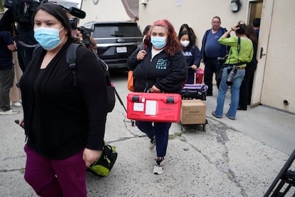 Los Angeles County Public Health Emergency Operations officials leave St. Anthony's Croatian Catholic Church after evaluating the newly arrived migrants being housed in Los Angeles, 2023